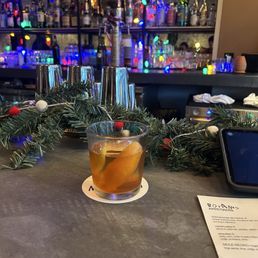 Old fashioned with the bar in the background. Old fashioned with the bar in the background.