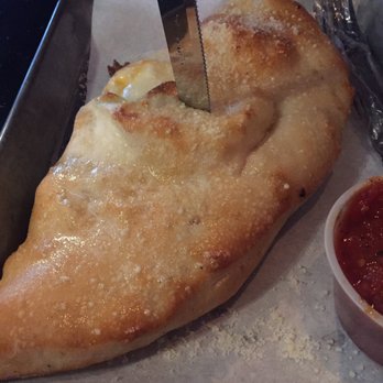 Sliced - Calzone with sausage - Pizza Near Me - Commerce, Georgia