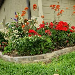 Double stacked pavers around flower bed