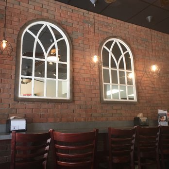 The Brick Coffee House - a brick wall with arched windows - Coffee & Tea Near Me - Jacksonville, Florida The Brick Coffee House - a brick wall with arched windows - Coffee & Tea Near Me - Jacksonville, Florida