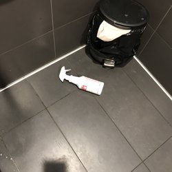 Went to the bathroom in the men's bathroom handicap stall found this dangerous rest room cleaner on the floor next to a small garbage bin