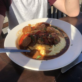 Flying Pig Pub & Kitchen - This is the bomb.com if you love shrimp and grits. The sauce is amazing and I could have drank it. Will go back for this dish alone. - Pubs Near Me - Oceanside, California
