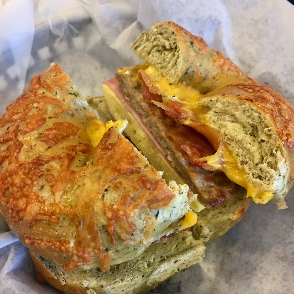 Old School Bagel Cafe - 3 Meat Breakfast Sandwich on Spinach Parmesan - Cafes Near Me - Stillwater, Oklahoma