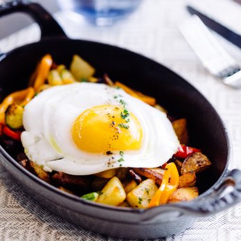Society 1854 - a skillet with a fried egg on top - New American Near Me - Omaha, Nebraska Society 1854 - a skillet with a fried egg on top - New American Near Me - Omaha, Nebraska