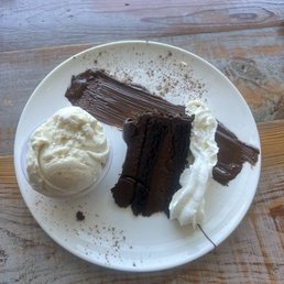 Dark chocolate cake with vanilla ice cream