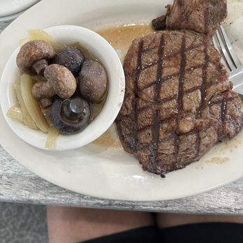 Damons Grill - Black Angus rib eye steak with onions and mushrooms - Seafood Near Me - Myrtle Beach, South Carolina