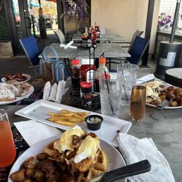 The plate in the front is Chicken & Waffle Benedict, to the right is Eggs Benedict with pork belly, and to the left is French Toast The plate in the front is Chicken & Waffle Benedict, to the right is Eggs Benedict with pork belly, and to the left is French Toast