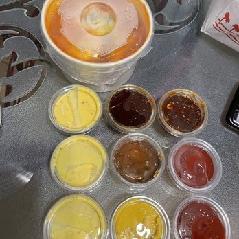 Frankseoul - Cheese Teokbbokki (Regular Size) in the back and all the yummy dipping sauces - Hot Dogs Near Me - Frisco, Texas Frankseoul - Cheese Teokbbokki (Regular Size) in the back and all the yummy dipping sauces - Hot Dogs Near Me - Frisco, Texas