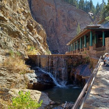 Seven Falls - Restaurant on the right. Stream with water from the falls on the left. - Amusement Parks Near Me - Colorado Springs, Colorado Seven Falls - Restaurant on the right. Stream with water from the falls on the left. - Amusement Parks Near Me - Colorado Springs, Colorado