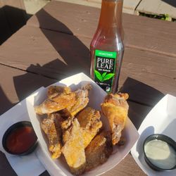 10 dry rubbed salt & vinegar wings and tea at a picnic table on the lawn