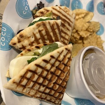 Cocu Bistro - a sandwich and chips on a plate - French Near Me - McAllen, Texas Cocu Bistro - a sandwich and chips on a plate - French Near Me - McAllen, Texas