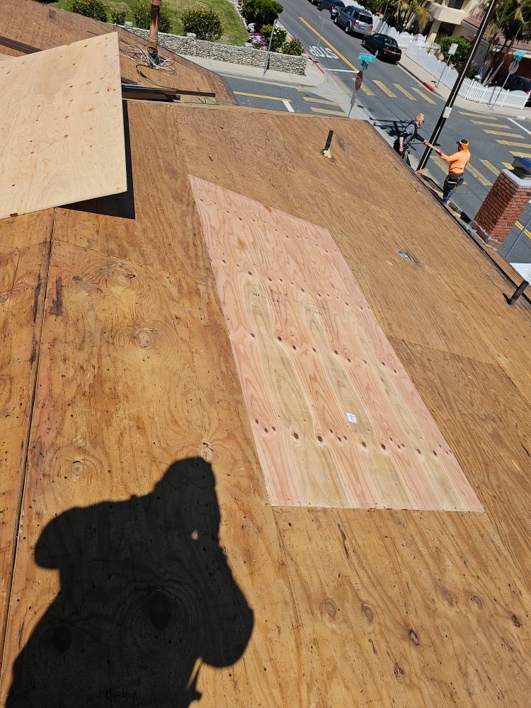 Slide of Juniors Roofing