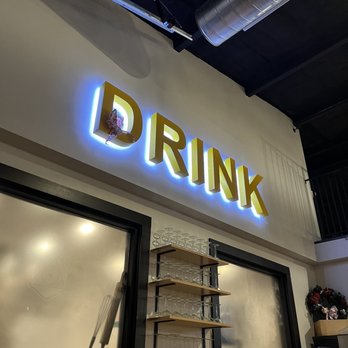 Alchemy Wine & Beer - a sign that says drink - Wine Bars Near Me - Hamburg, New York