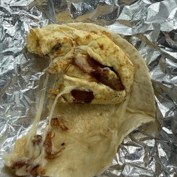 Tortas DF - Breakfast taco showing the amount of bacon - Mexican Near Me - Lewisville, Texas Tortas DF - Breakfast taco showing the amount of bacon - Mexican Near Me - Lewisville, Texas