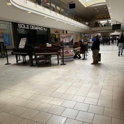Livingston Mall - Someone was playing piano which are there for display for anyone who is interested in buying them. Mostly used pianos.