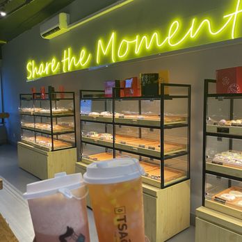 Bake Culture - a hand holding a cup of coffee in front of a bakery - Bubble Tea Near Me - Staten Island, New York Bake Culture - a hand holding a cup of coffee in front of a bakery - Bubble Tea Near Me - Staten Island, New York