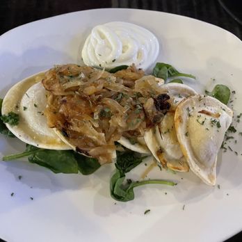 Ale & Eddies TapHouse - Cheese pierogis, topped with sauerkraut. - Tapas/Small Plates Near Me - Warren, Michigan Ale & Eddies TapHouse - Cheese pierogis, topped with sauerkraut. - Tapas/Small Plates Near Me - Warren, Michigan
