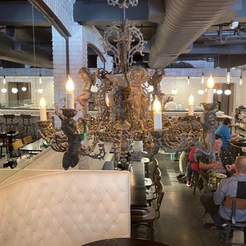 Pa’La Downtown - Ornate Cupid Chandelier over booth seating in the dining room... - Mediterranean Near Me - Phoenix, Arizona Pa’La Downtown - Ornate Cupid Chandelier over booth seating in the dining room... - Mediterranean Near Me - Phoenix, Arizona