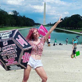 Washington Monument - Pink haired lady sits in front of Lincoln Memorial talking on the phone with an umbrella that says #FreeBritney - Landmarks & Historical Buildings Near Me - Washington, DC, District of Columbia Washington Monument - Pink haired lady sits in front of Lincoln Memorial talking on the phone with an umbrella that says #FreeBritney - Landmarks & Historical Buildings Near Me - Washington, DC, District of Columbia