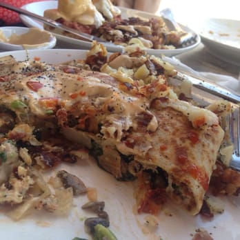 Cafe M - Crab cake crepe w breakfast potatoes and corned beef bene behind. - Breakfast & Brunch Near Me - Berkeley, California Cafe M - Crab cake crepe w breakfast potatoes and corned beef bene behind. - Breakfast & Brunch Near Me - Berkeley, California