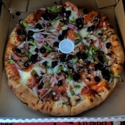 Pizza Pirates - Half "California Veggie", half "Ultimate", medium specialty pizza.