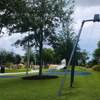 James Holland Park - Zip line, rock climbing slides, swings, paved pathways for scooters and strollers - Dog Parks Near Me - Palm Coast, Florida James Holland Park - Zip line, rock climbing slides, swings, paved pathways for scooters and strollers - Dog Parks Near Me - Palm Coast, Florida