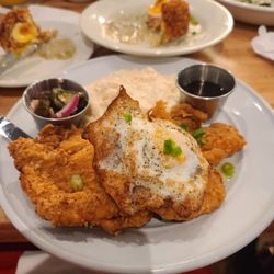 Phoebe's Diner - Fried chicken and grits with a fried egg over medium