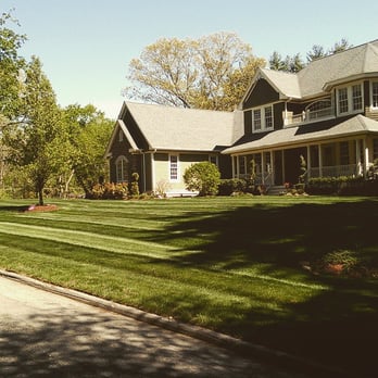 Central Mass Landscapes - a large house with a lawn in front of it - Landscaping Near Me Central Mass Landscapes - a large house with a lawn in front of it - Landscaping Near Me