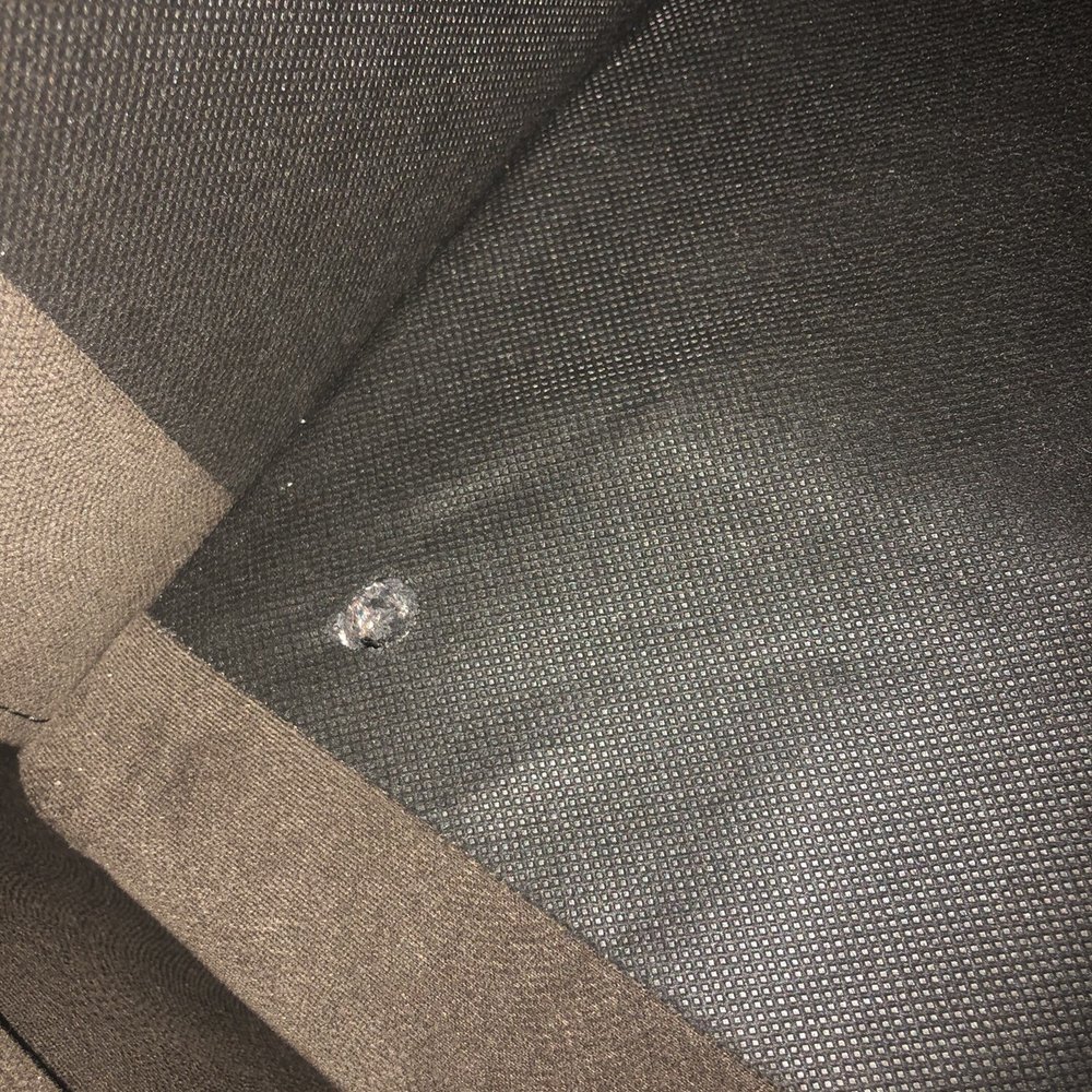 Couch Potato - Holes from a burn mark under the seats of a "new" sofa - Interior Design Near Me - Morro Bay, California Couch Potato - Holes from a burn mark under the seats of a "new" sofa - Interior Design Near Me - Morro Bay, California