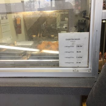 Big T's Place - a sign in a window - Chicken Wings Near Me - Gwynn Oak, Maryland