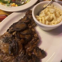 Ribeye with smothered mushrooms, side of Mac and house salad