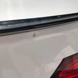 Huge dent right under the spoiler Huge dent right under the spoiler