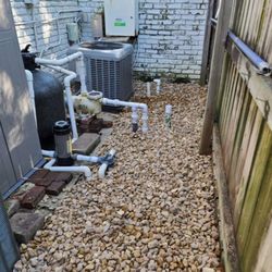 Zion Lawn & Landscape - Rock installation around the AC unit and pool pump to keep the area dry, and clean.