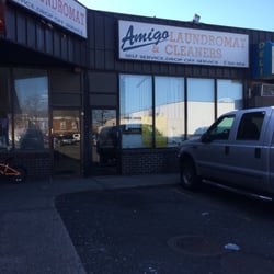 Amigo Laundromat and Cleaners - Front of the laundromat. There are resturaunts, a deli, and a barbershop near it.