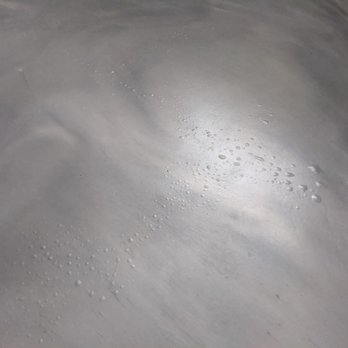 Buss Custom Concrete - Epoxy coating, metallic matte with excessive blistering/bubbles due to incorrect prep of the concrete - Flooring Near Me - Hometown, Illinois