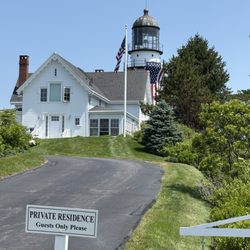View of the lighthouse on a private road from outside the park.