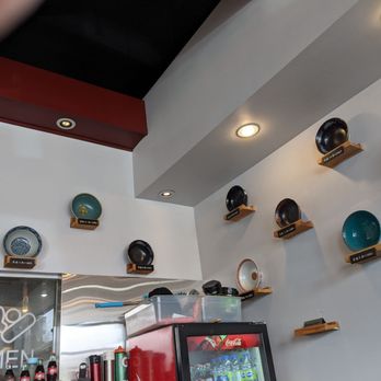 Ajisen Ramen - a variety of bowls on a wall - Ramen Near Me - Markham, Ontario