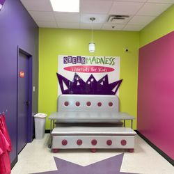 Shear Madness Haircuts for Kids - Dedicated party space - there's also a small table to the side (against the pink wall) for food, etc. Not a ton of space for parents.