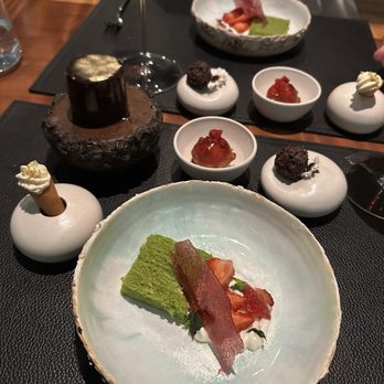 Aubergine - Olive oil & basil cake, tuille, strawberries, ice cream, ricotta fritter with plum glaze, chocolate & gold mousse - New American Near Me - Carmel, California