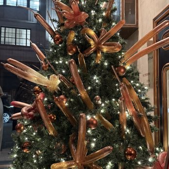 Dishoom - Festive Christmas tree at the front to greet visitors - Indian Near Me - Kensington, XGL Dishoom - Festive Christmas tree at the front to greet visitors - Indian Near Me - Kensington, XGL