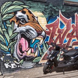 Lance Cabo 125 with Larimer St. wall art. Lance Cabo 125 with Larimer St. wall art.