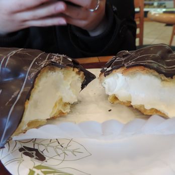 Stone Crock Bakery - Inside shot of the chocolate eclair, showing the rich cream filling! - Coffee & Tea Near Me - St. Jacobs, Ontario