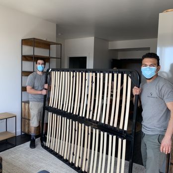Venmex Moving - The guys moving in the bed frame. - Movers Near Me Venmex Moving - The guys moving in the bed frame. - Movers Near Me