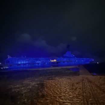 Pier 99 - USS Lexington lit up at night - Seafood Near Me - Corpus Christi, Texas