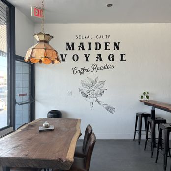 Maiden Voyage - To the left: Table and chairs by window To the right: an L shaped bar with stools - Coffee Roasteries Near Me - Selma, California Maiden Voyage - To the left: Table and chairs by window To the right: an L shaped bar with stools - Coffee Roasteries Near Me - Selma, California