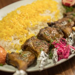Kebab & Kurry - Rack of Lamb with saffron rice and grilled tomato.
