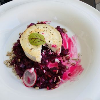 Cafe Restaurant Europejska - warm goat cheese over beets and sunflower seeds - Cafes Near Me - Kraków, Massachusetts