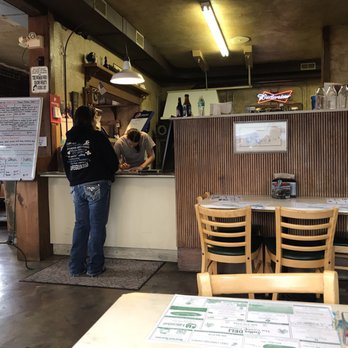Sutter Deli - a woman standing at a counter - Restaurants Near Me - Grand Island, Nebraska