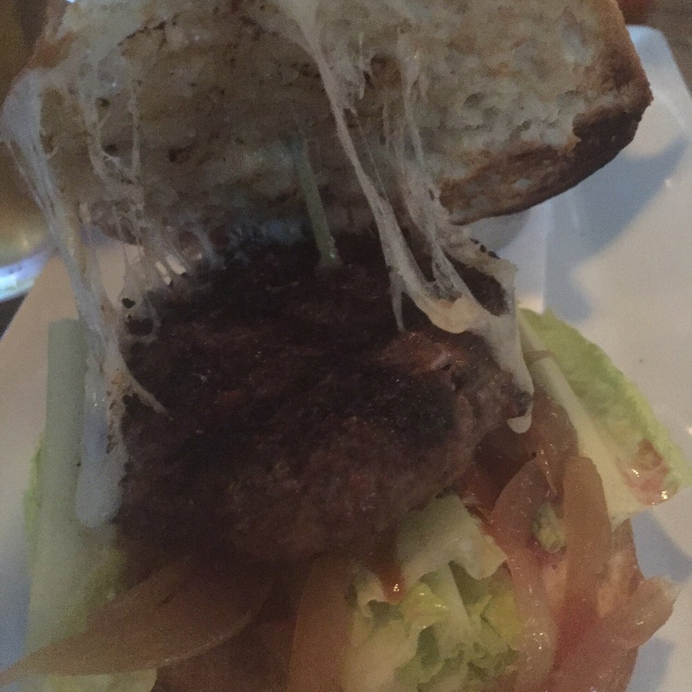 Gantry Bar & Kitchen - My $14 gantry burger - slider sized burger on a full size bun. don't think they are going to charge me half price for half a burger. - New American Near Me - Long Island City, New York