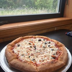 Bourbon Street Pizza - Build your own: cheese, black olives, and tomatoes with oregano